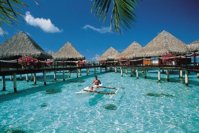 tahiti-village-man.boat.jpg